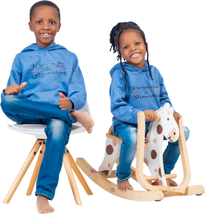 Two smiling DTB Kids in Purposeful and Flourishing hoodies